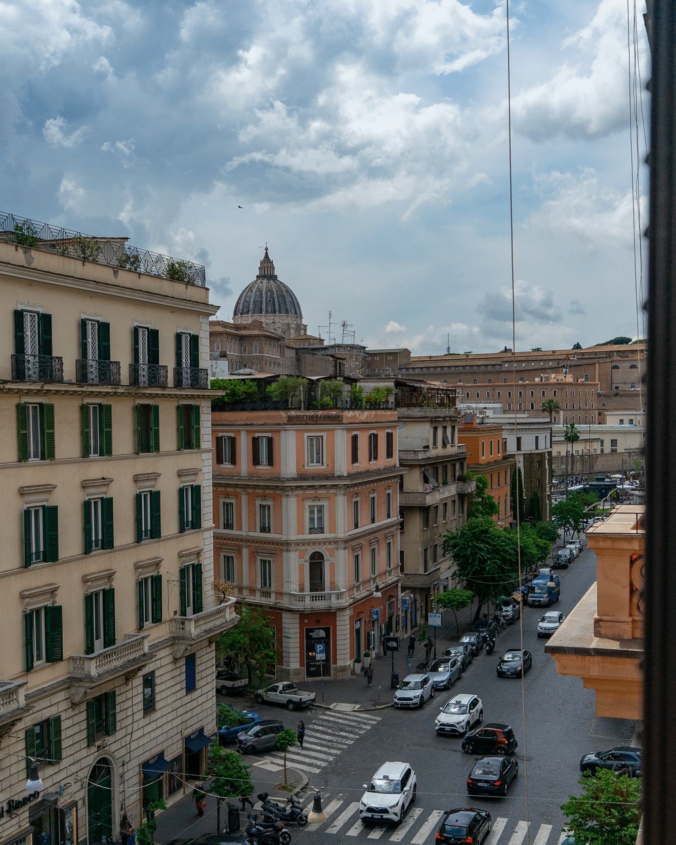 View of St. Peter's from the balcony of a room View of the Dome of St. Peter's with a cloudy sky, visible from the Deluxe room balcony